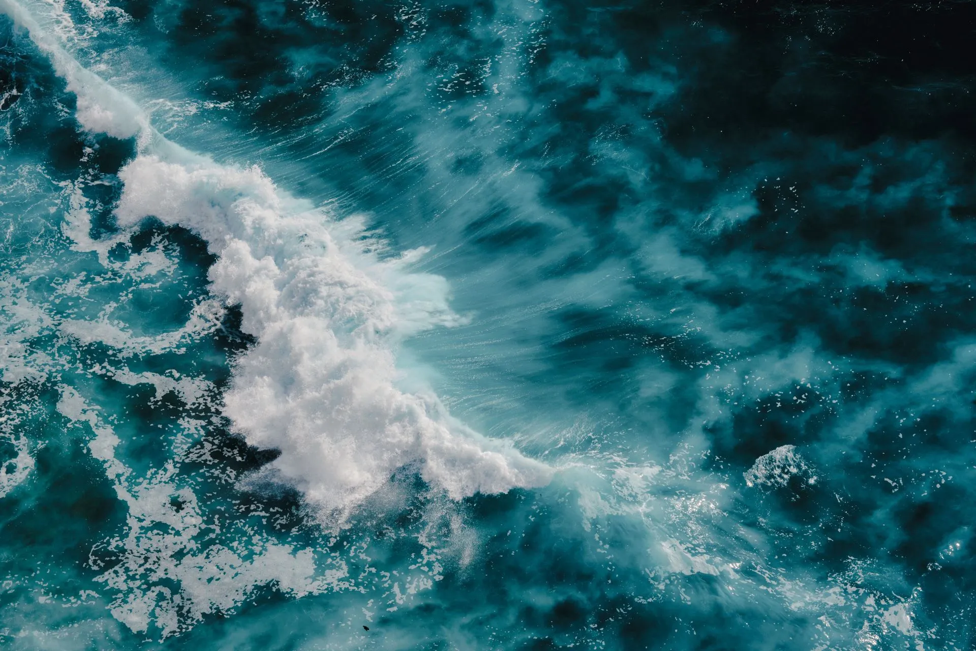 Foaming ocean wave, turquoise water, aerial view.